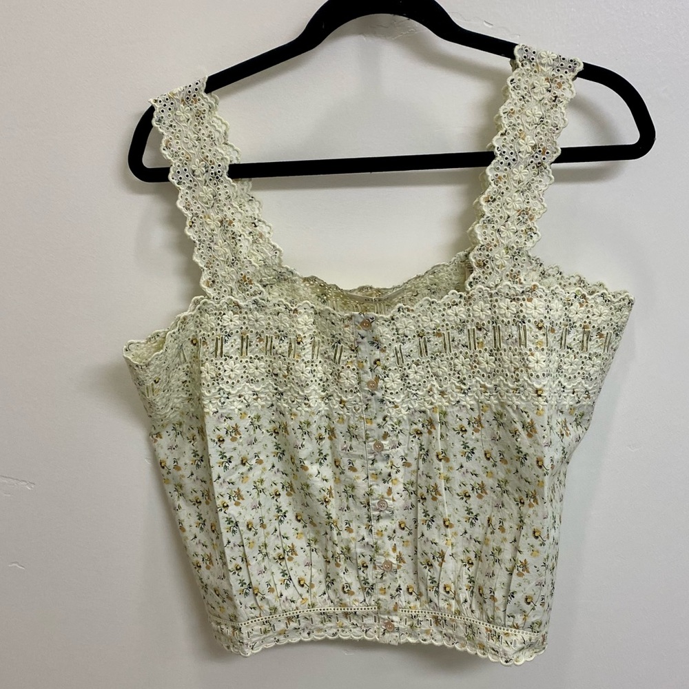 Crop tank , buttons down the front.